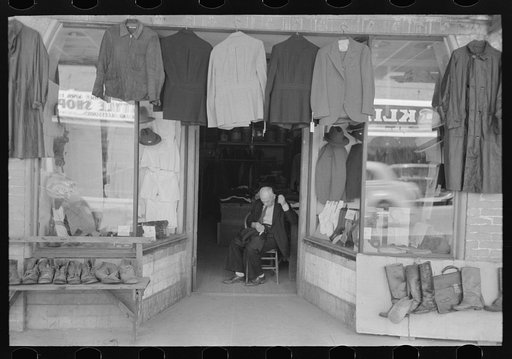 Clothing store with tailor in doorway, Mexican district, San Antonio, Texas
