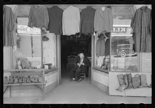 Untitled photo, possibly related to: Clothing store with tailor in doorway, Mexican district, San Antonio, Texas