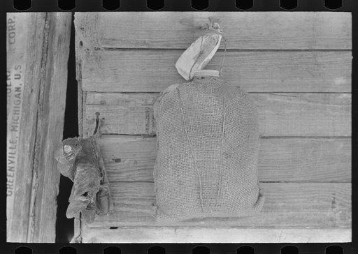Burlap-covered water bottle in Mexican house, San Antonio, Texas