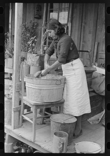 Mexican woman washing clothes, San Antonio, Texas