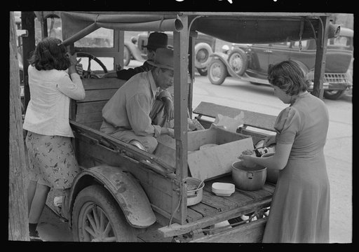 Mexican lunch wagon serving tortillas and fried beans to workers in pecan shelling plant, San Antonio, Texas