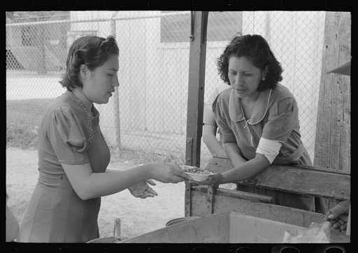 Pecan sheller buying fried beans for her lunch, San Antonio, Texas