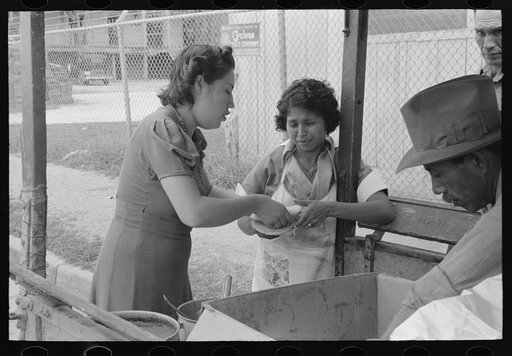 Untitled photo, possibly related to: Pecan sheller buying fried beans for her lunch, San Antonio, Texas