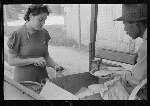 Untitled photo, possibly related to: Preparing plates of tortillas and fried beans to sell to pecan shellers, San Antonio, Texas