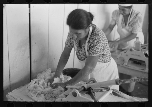 Untitled photo, possibly related to: Counting out tortillas to sell. The price is five cents per dozen. San Antonio, Texas