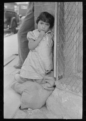 Young Mexican girl who was playing around relief line in San Antonio, Texas