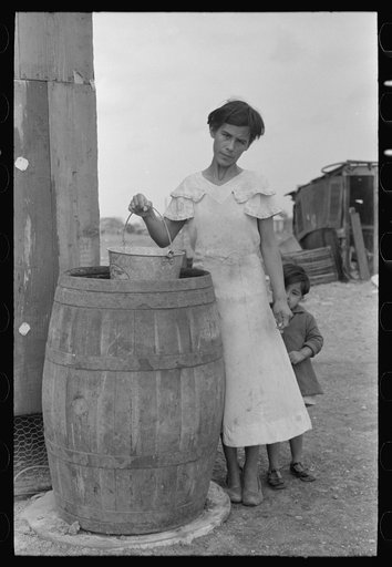 San Antonio. The Mexican section. Water supply of Mexican family living on the outskirts of town. This water is brought from the city and is delivered by wagon