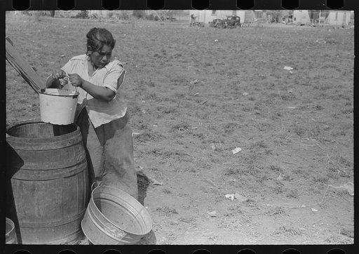 Untitled photo, possibly related to: San Antonio. The Mexican section. Water supply of Mexican family living on the outskirts of town. This water is brought from the city and is delivered by wagon