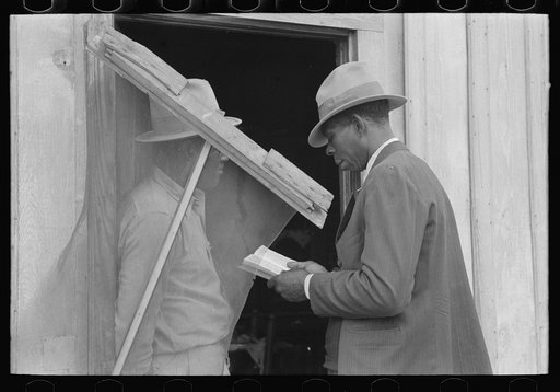 Untitled photo, possibly related to: Negro Preacher reading the scriptures to Negro man, San Antonio, Texas