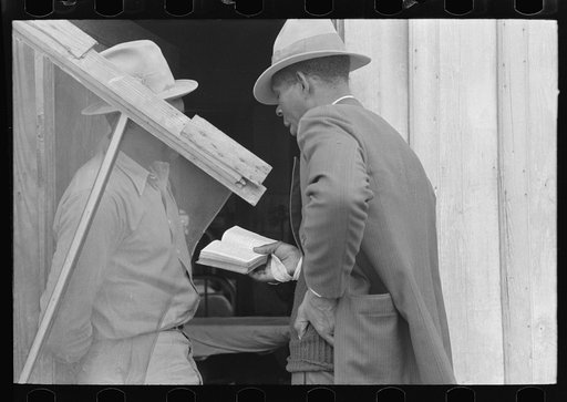 Negro Preacher reading the scriptures to Negro man, San Antonio, Texas