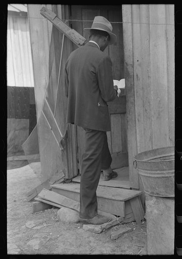 Untitled photo, possibly related to: Negro Preacher reading the scriptures to Negro man, San Antonio, Texas