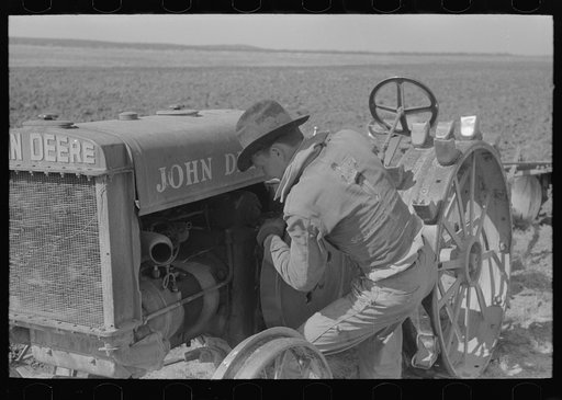 Starting a tractor by starting the flywheel, El Indio, Texas