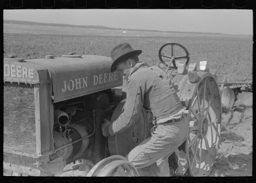 Untitled photo, possibly related to: Starting a tractor by starting the flywheel, El Indio, Texas