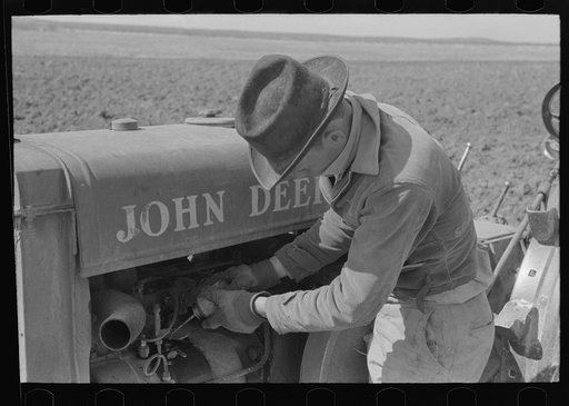 Priming a tractor with gasoline, El Indio, Texas