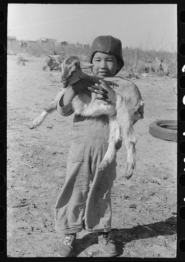 Mexican boy with goat, Crystal City, Texas