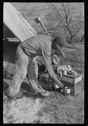 Mexican land grubber in front of his camp, El Indio, Texas