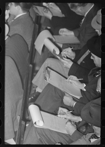 Untitled photo, possibly related to: Group of buyers at strawberry auction, Hammond, Louisiana. Third man from right in front row is bidding