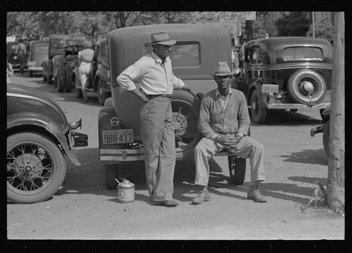 Negro farmers sitting on back of automobile, San Augustine, Texas