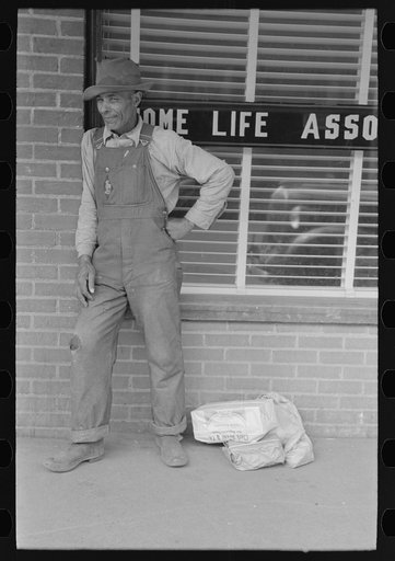 Untitled photo, possibly related to: Negro farmer with supplies in town, San Augustine, Texas
