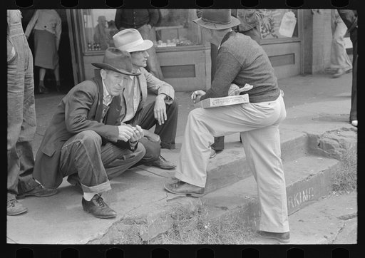 Men talking on the main street of San Augustine, Texas