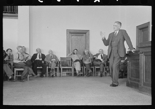 President of bank speaking to a group of San Augustine county residents at a meeting held to discuss raising of funds to continue WPA (Work Projects Administration) roadwork, San Augustine, Texas