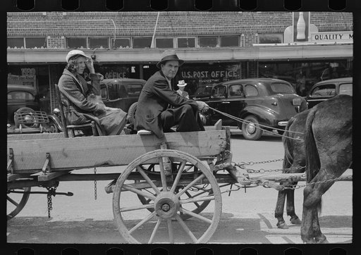 Farmer and daughter in wagon, Saturday afternoon, San Augustine, Texas