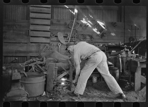 Blacksmith at work in his shop, San Augustine, Texas