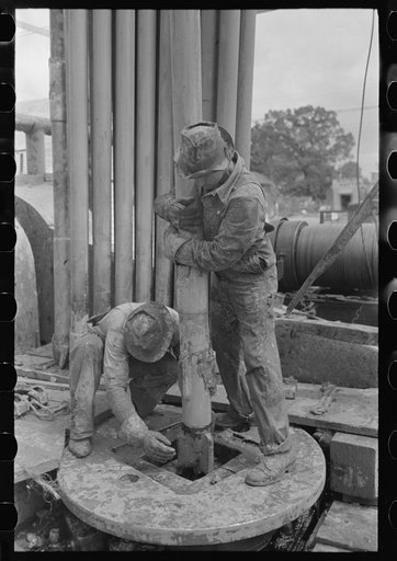 Guiding bit through rotary table, oil well, Kilgore, Texas