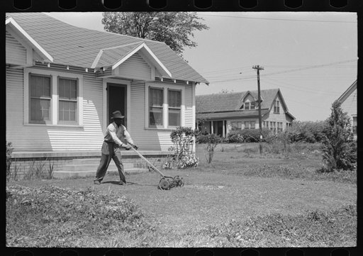 Negro mowing lawn, San Augustine, Texas