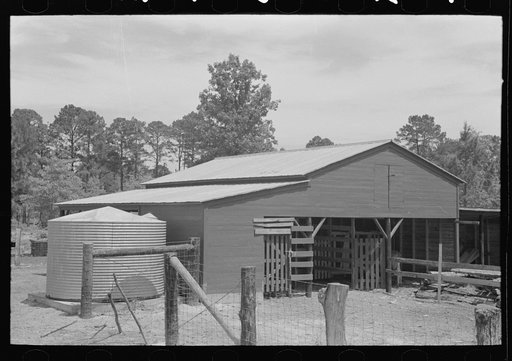 Barn and water tank of FSA (Farm Security Administration) client, Sabine Farms, Marshall, Texas