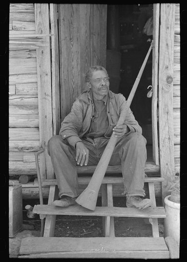 Untitled photo, possibly related to: Old Negro (former slave) Willis Winn with horn with which slaves were called. Near Marshall, Texas