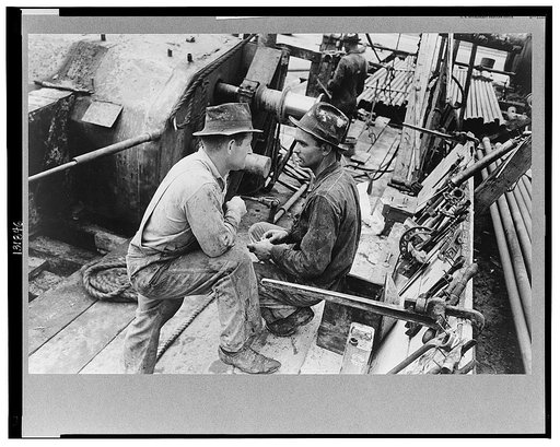 Oil field workers talking, Kilgore, Texas
