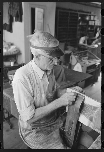 Sewing uppers of boots together in bootmaking shop, Alpine, Texas