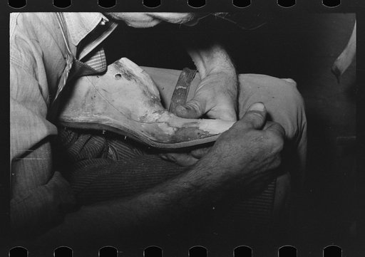 Untitled photo, possibly related to: Trimming edge of inner sole. Boot shop, Alpine, Texas