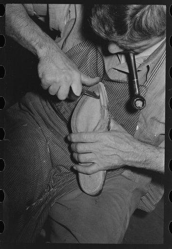 Grooving inner sole in process of making welt. Bootmaking shop, Alpine, Texas