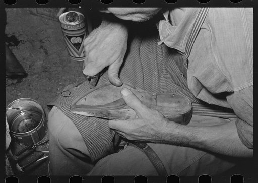 Outside grooving of inner sole in process of making welt. Bootmaking shop, Alpine, Texas