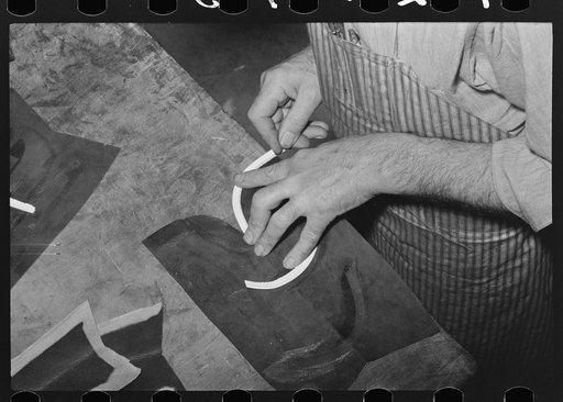 Fitting beading to upper of boot in bootmaking shop. Alpine, Texas