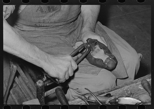 Stretching piece of leather which forms the foot across the sole. Cowboy boot shop, Alpine, Texas