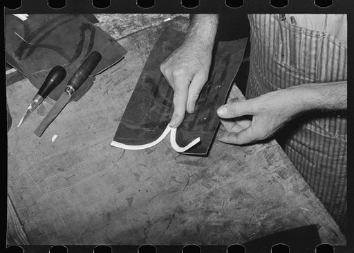 Cementing beading to upper, cowboy boot shop. Alpine, Texas