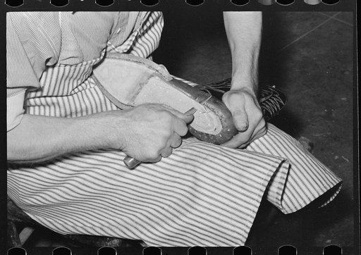 Trimming lower part of boot. Cowboy bootmaking shop, Alpine, Texas