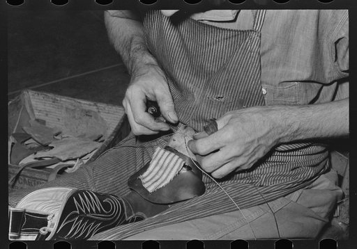 Sewing cap into toe of boot. Cowboy bootmaking shop, Alpine, Texas