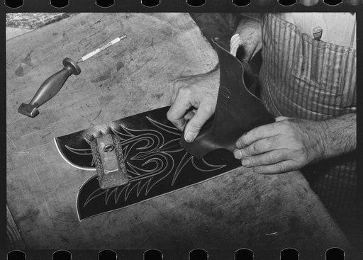 Untitled photo, possibly related to: Fitting upper to lower part of boot. Bootmaking shop, Alpine, Texas