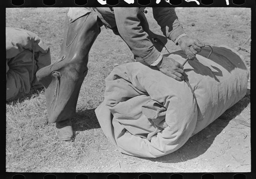 Tying the bedroll. Bunk of the cowboy on the range. Cattle ranch near Marfa, Texas