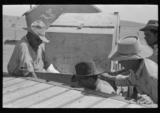 Untitled photo, possibly related to: Cowboy tying up bedroll. Cattle ranch near Marfa, Texas