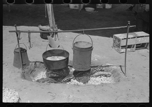 Dinner cooking over an open fire. Cattle ranch near Spur, Texas