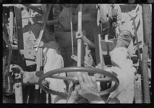 Untitled photo, possibly related to: Day laborer on tractor on large farm near Ralls, Texas