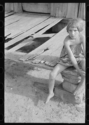 Untitled photo, possibly related to: Daughter of agricultural day laborer on porch of her home, McIntosh County, Oklahoma