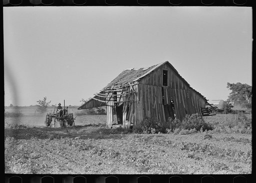 Tractor plowing near abandoned and wrecked tenant house, Wagoner County, Oklahoma
