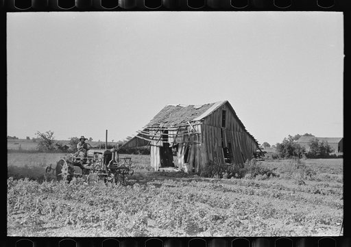Untitled photo, possibly related to: Tractor plowing near abandoned and wrecked tenant house, Wagoner County, Oklahoma
