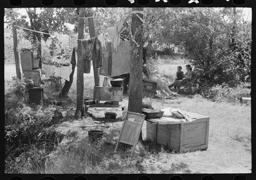 Camp by the roadside near Spiro, Oklahoma. This family did agricultural day labor to obtain funds to go to Arizona and California. Sequoyah County, Oklahoma